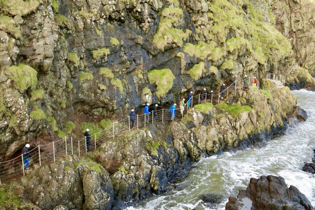 people walking on trail at Gobbins Cliffs