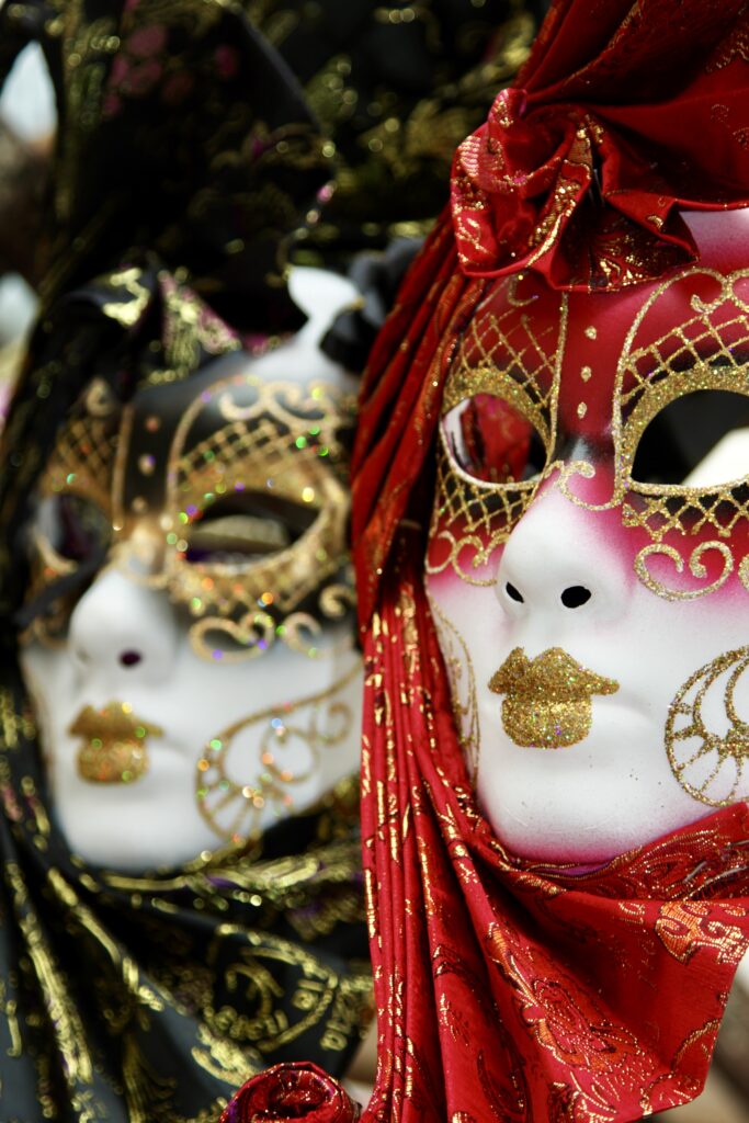women in Venetian masks