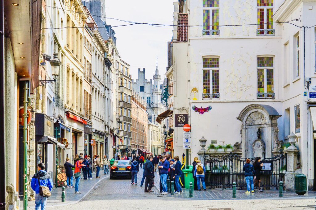 group of tourists visiting Manneken Pis  in Brussels