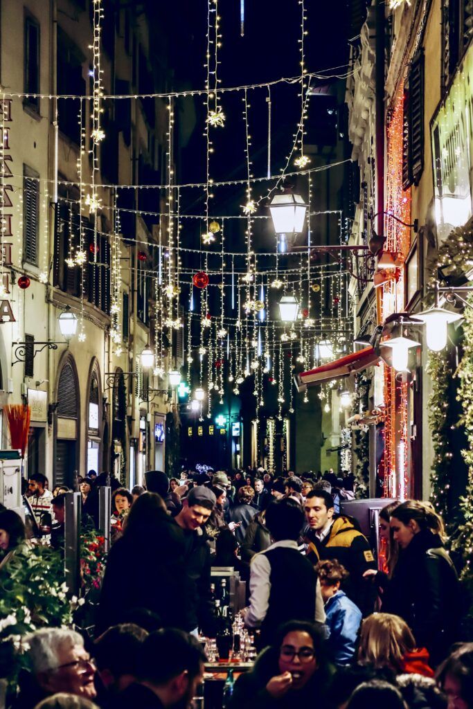 street lit up with lights in Florence during Christmas season