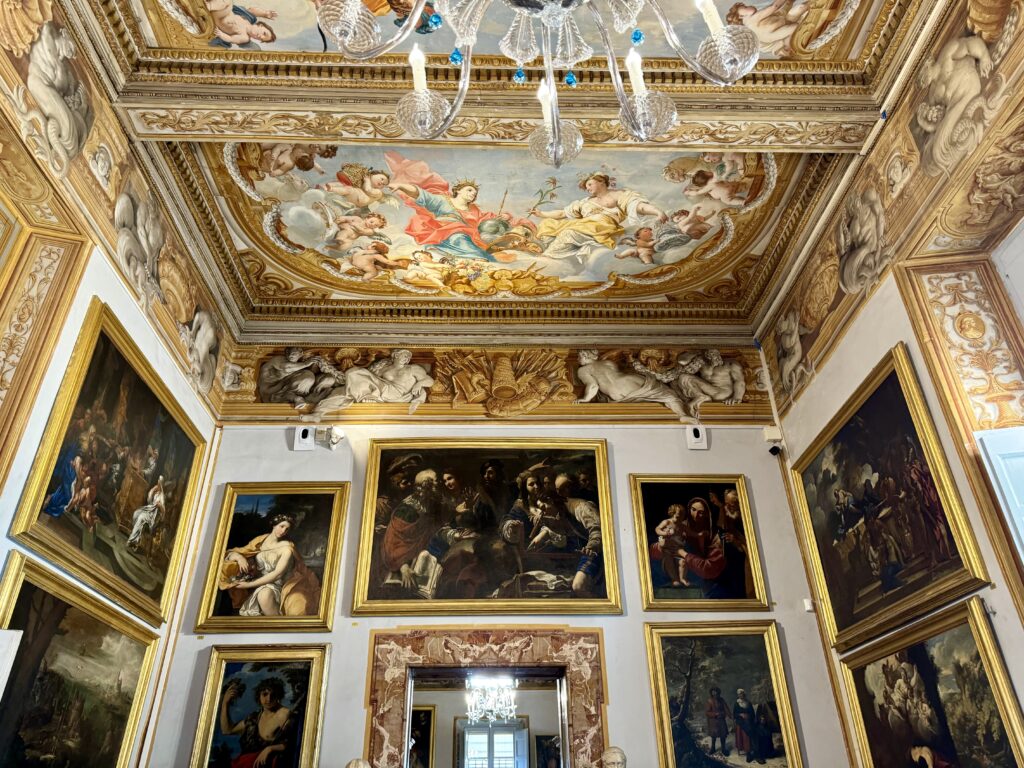 beautiful room in the palazzo with paintings and ceiling frescos