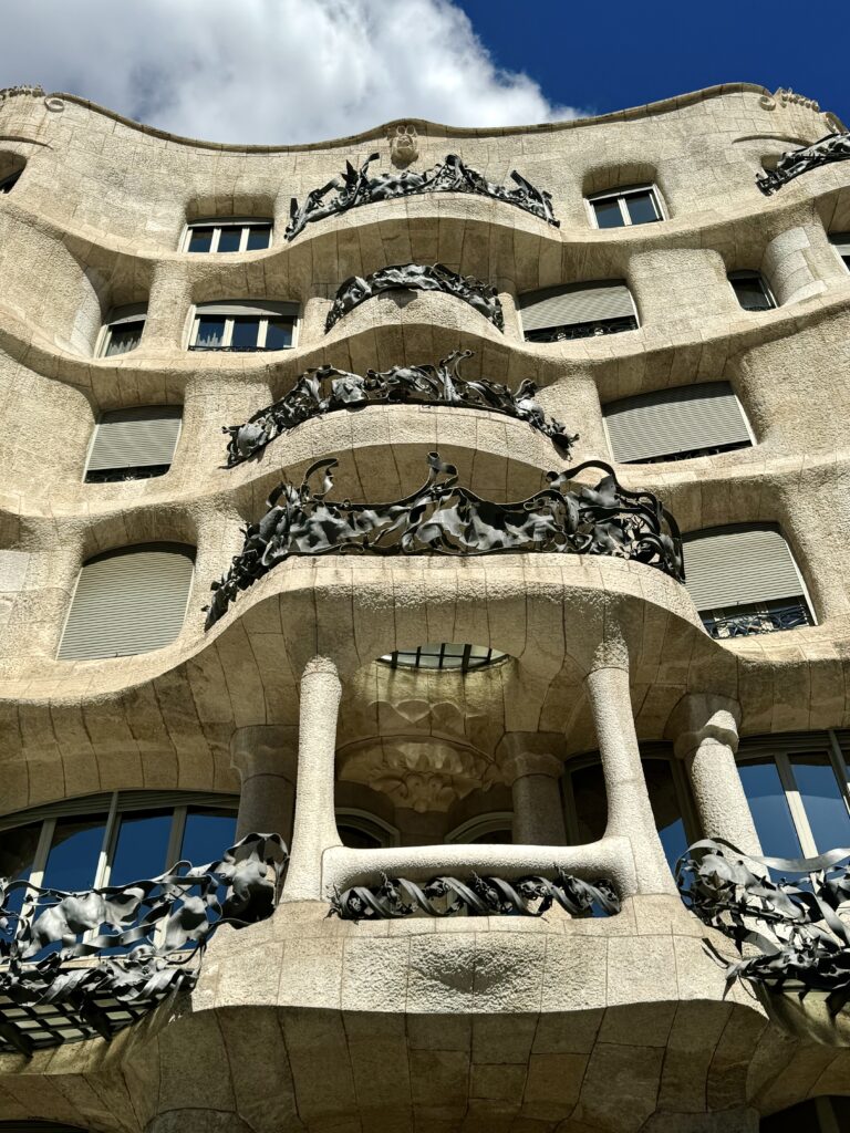 curvy facade with wrought iron balconies