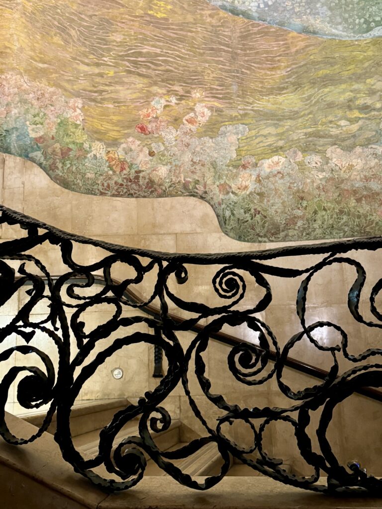 murals and the wrought iron on the staircase