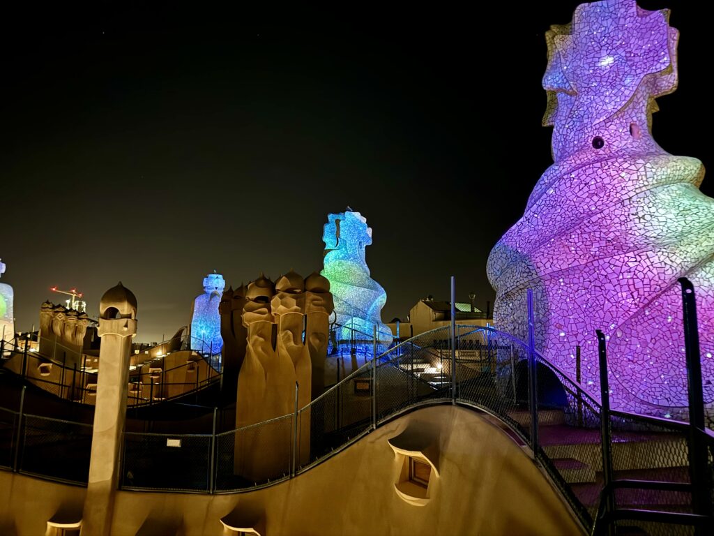 rooftop sculptures lit up at night