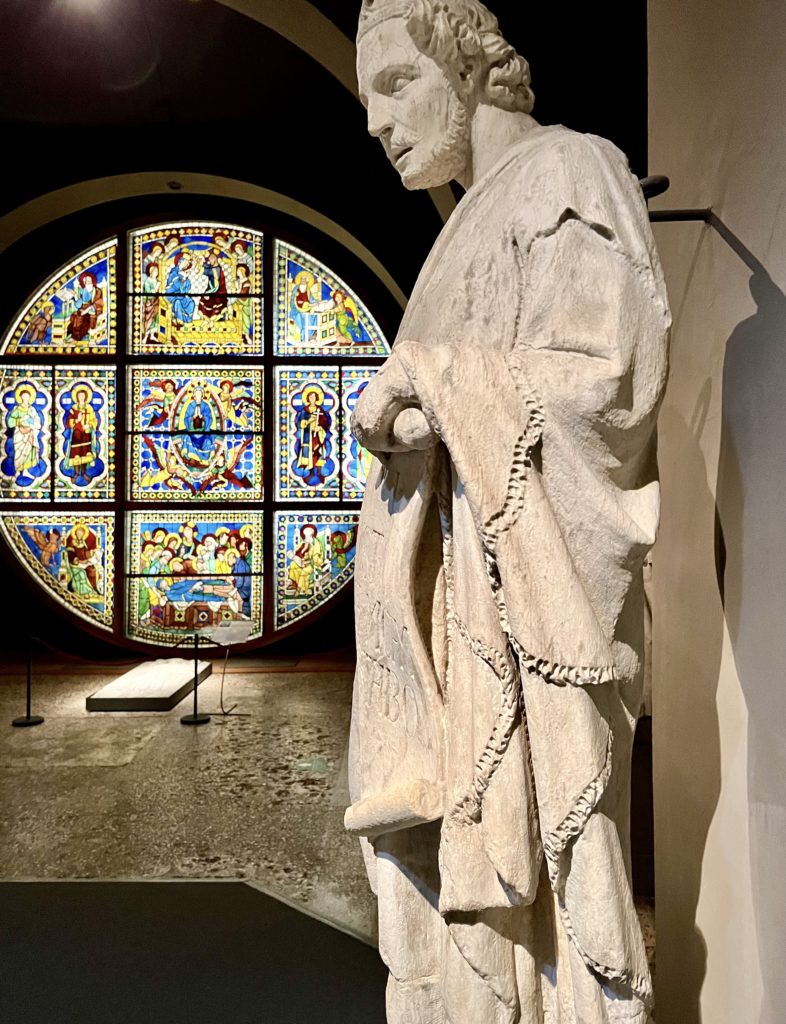 rose window and sculpture in the Duomo Museum