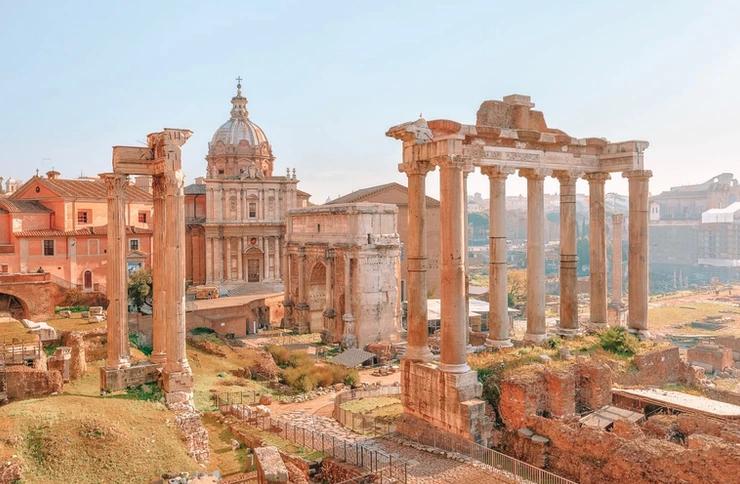 classic shot of the Roman Forum, with the ruins of the Temple of Castor and Pollux and the Temple of Saturn