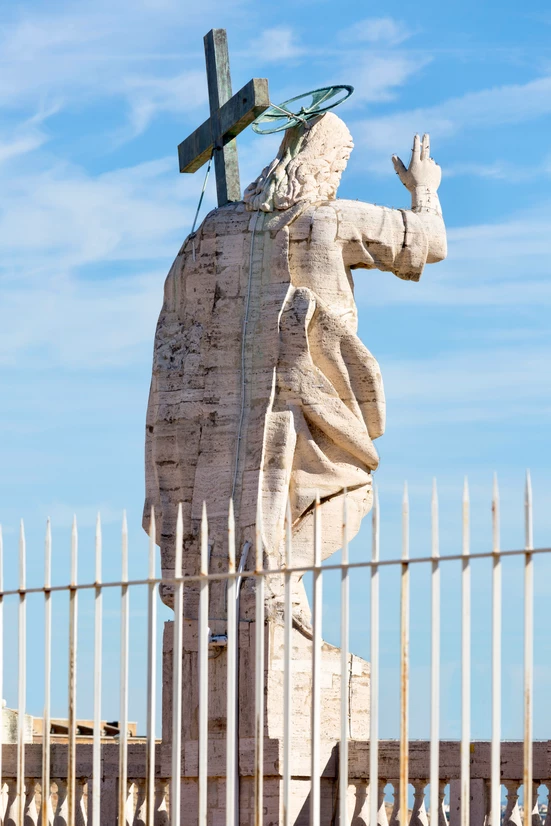 statue of Jesus on the facade of St. Peter's Basilica