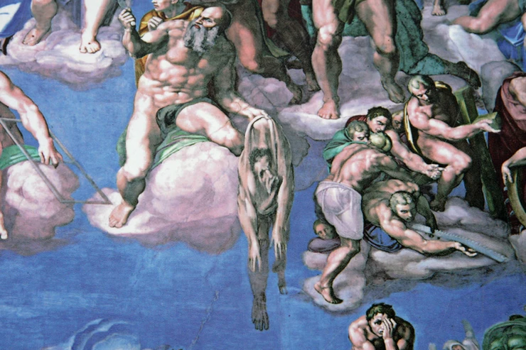Michelangelo's face face is on the shedded serpent skin held by Saint Bartholomew.