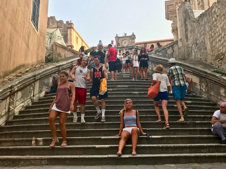 my daughter on the Jesuit Staircase on a busy summer day