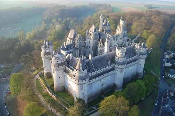 Erected in the late 14th century by Duke Louis of Orléans, the Château de Pierrefonds was taken down in the 17th century and was in ruins when Napoleon III decided to commission architect Eugène Viollet-le-Duc to rebuild it. He applied his architectural designs to create the ideal château, such as would have existed in the Middle Ages.