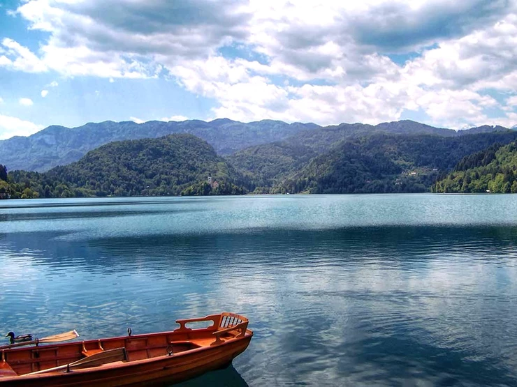 a wooden row boat on Lake Bled