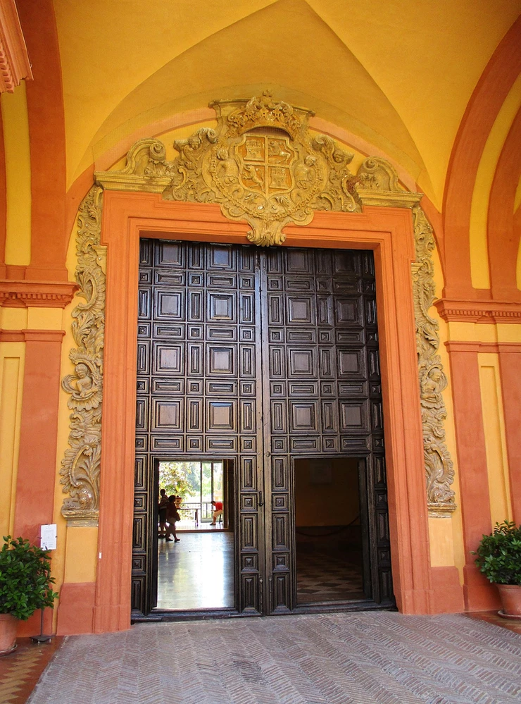 a baroque door in the Alcazar that is the entrance to the Gothic Palace