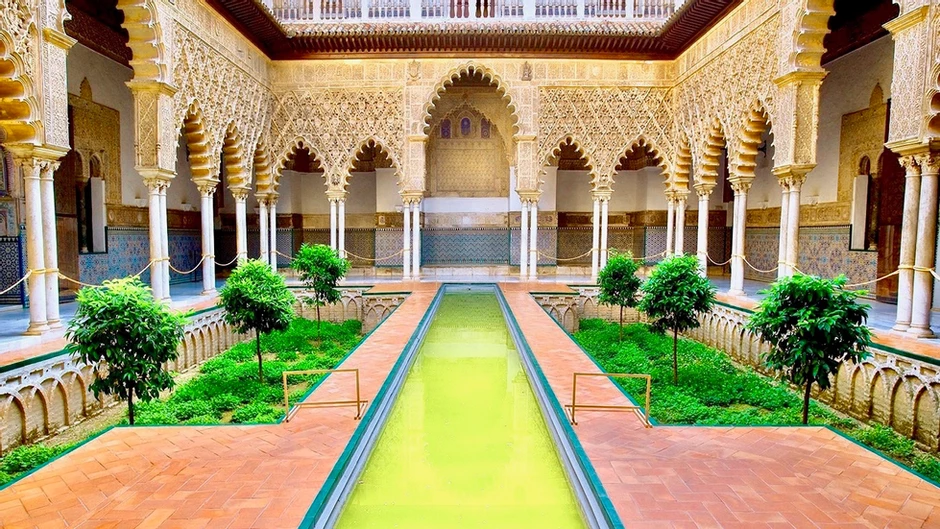 Courtyard of the Maidens with its long reflecting pool in the Alcazar
