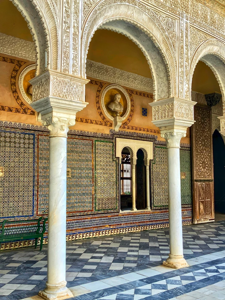 Mudejar arches and azulejo tiles in the courtyard of Casa de Pilatos