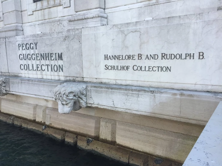sign giving Peggy Guggenheim and the Schulhofs co-equal billing