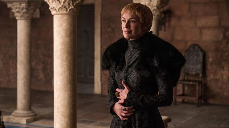 Cersei clutches her stomach convincing Tyrion that she's pregnant