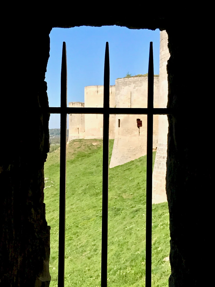 peaking through the window at the remains of the chateau's curtain wall