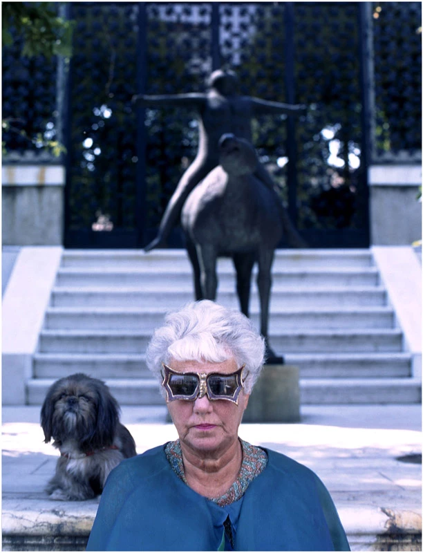 Peggy Guggenheim in Venice. Her Marino Marini sculpture in the background. Her palace in Venice is now the Peggy Guggenheim Collection.