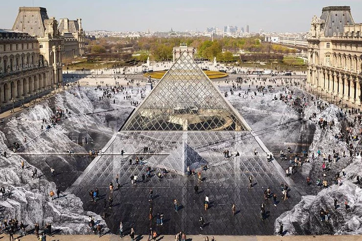 April 2019 artist JR installation at the Louvre, which by illusions shows the I.M. Pei Pyramid in a crater.