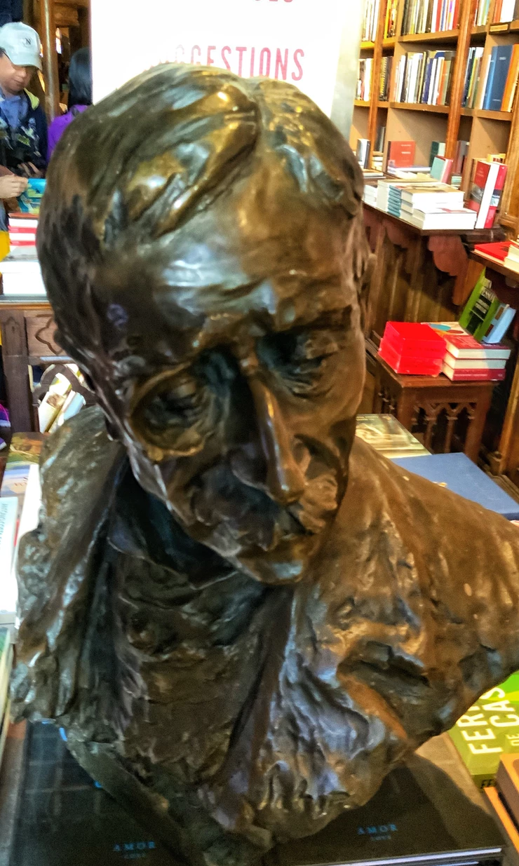 one of the bronze busts of Portuguese writers scattered throughout the bookstore