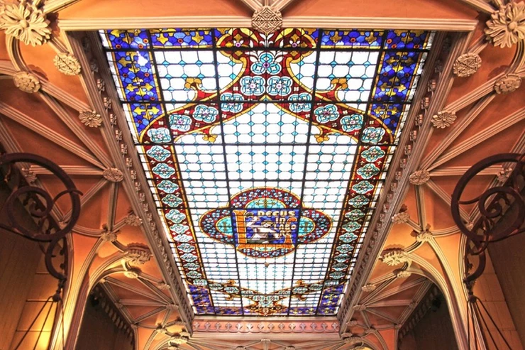 the stained glass skylight in Livraria Lello bookstore in Porto