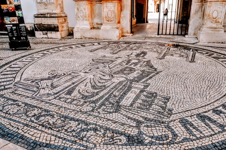 Minerva mosaic in front of the Porta Ferrea.  Minerva is the Roman goddess of wisdom.