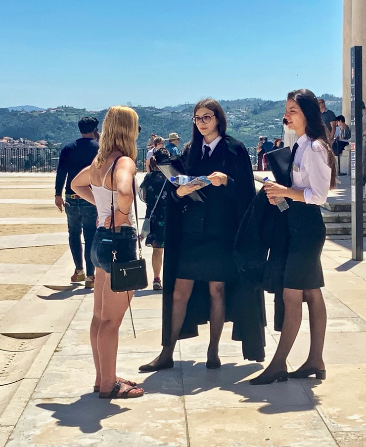 my daughter chatting with some black caped Coimbra students