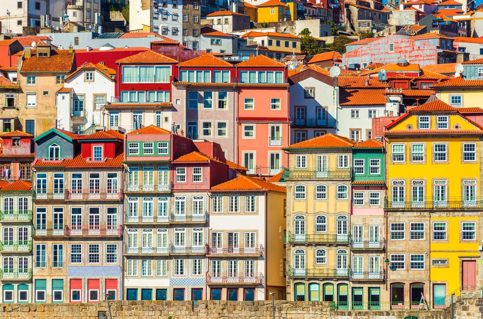 pretty facades on the Cais de Ribeira in Porto Portugal