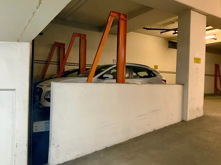 My little white car named Gretel, squeezed in a tight spot on a car elevator at my Air Bnb in Nuremberg 