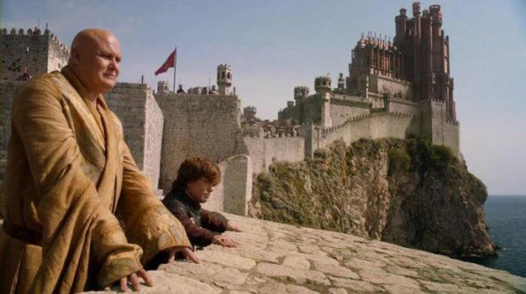 Varys and Tyrion discuss strategy on the walls of Dubrovnik with a CGI'd Fort Bokar n the background