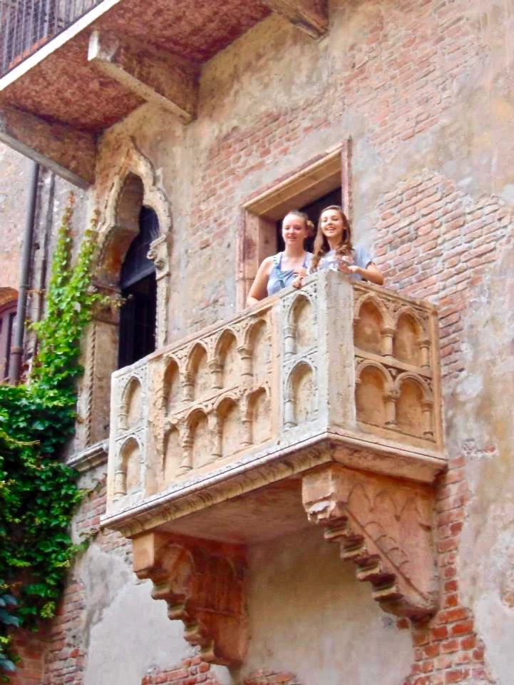 my daughter Gillian and her friend on Juliet's balcony in Verona