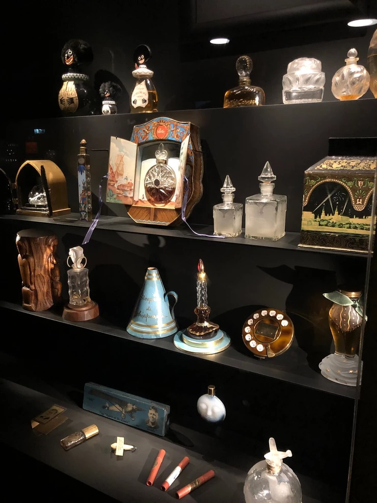 a display of perfume curiosities and artifacts at the Fragonard Perfume Museum in Paris