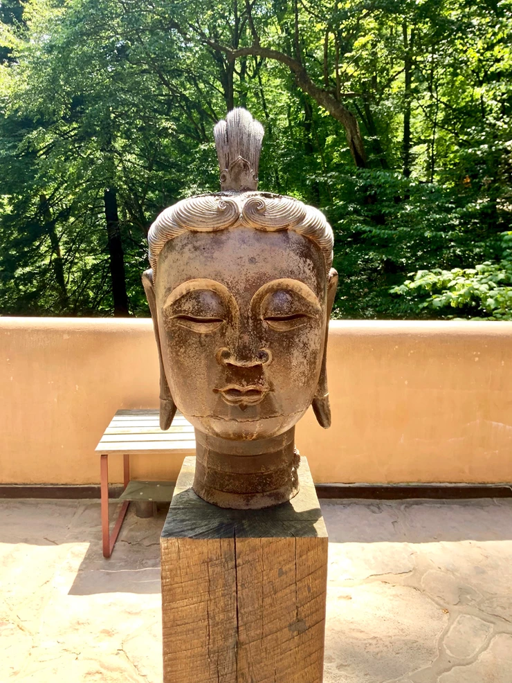 On the first floor terrace, there's a head of Buddha. It was cast in iron during the Sung Dynasty, between 906 and 1127. 