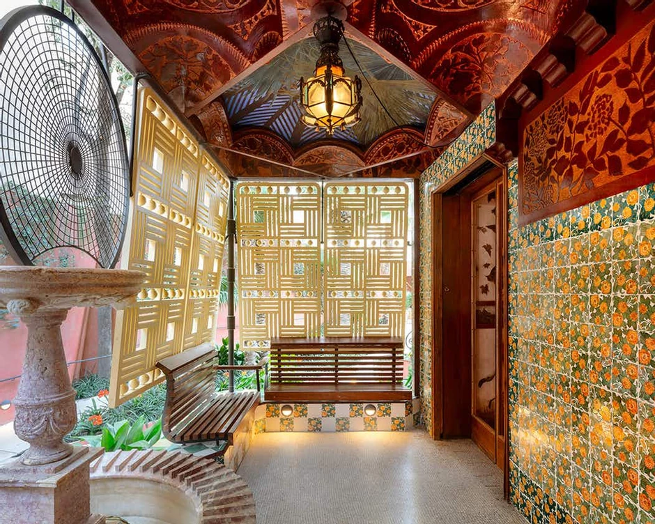first floor terrace of Casa Vicens with marigold tiles and geometric screens