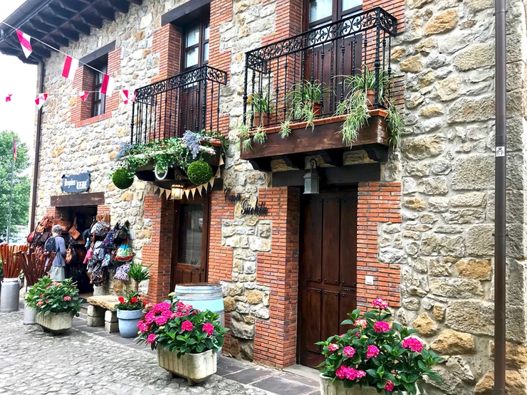 wrought iron balconies and flower pots in medieval Santillana del Mar