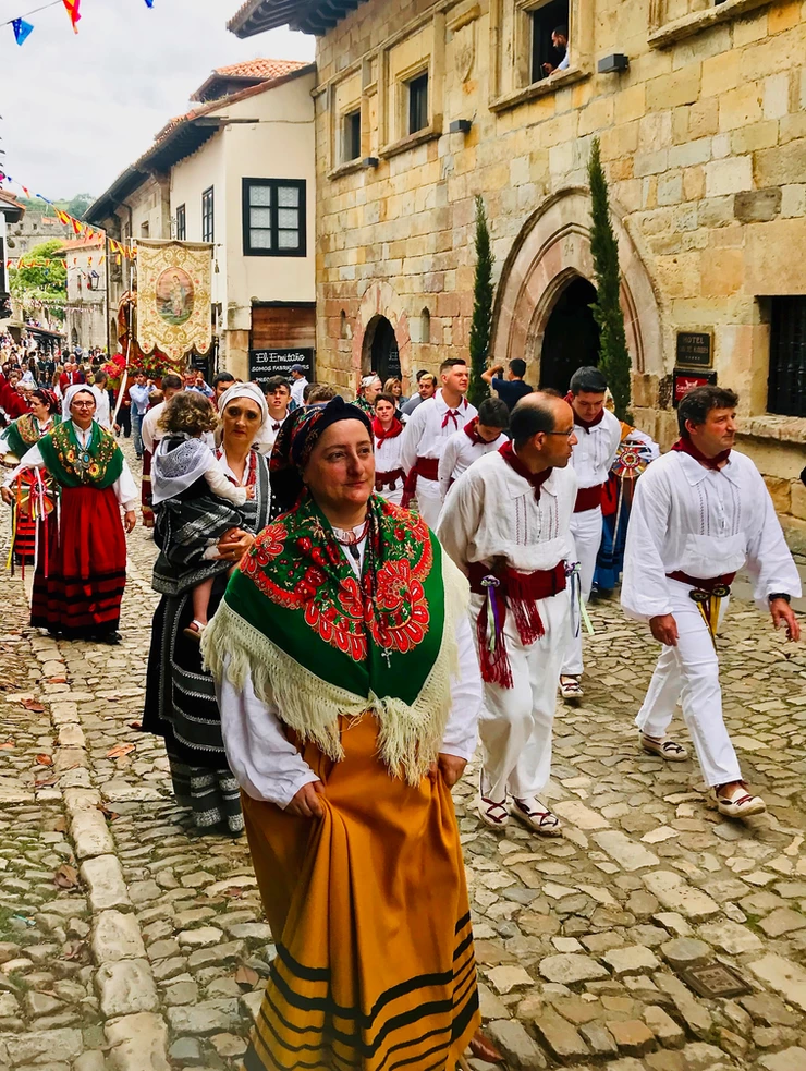 a religious procession to the Colegiata in Santillana del Mar
