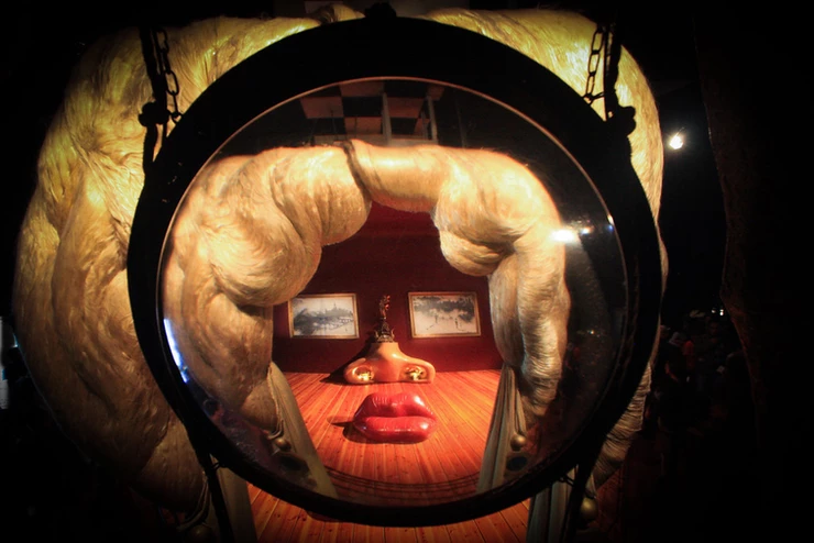 view of the Mae West Room, seen through a sculpture of blond hair, as Dali intended