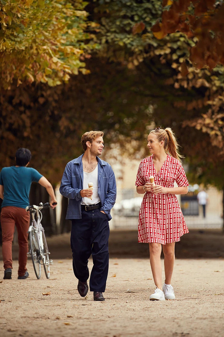Villanelle and Sebastian walk in the Jardin des Tuileries for which Villanelle dons a playful Mui Mui dress.