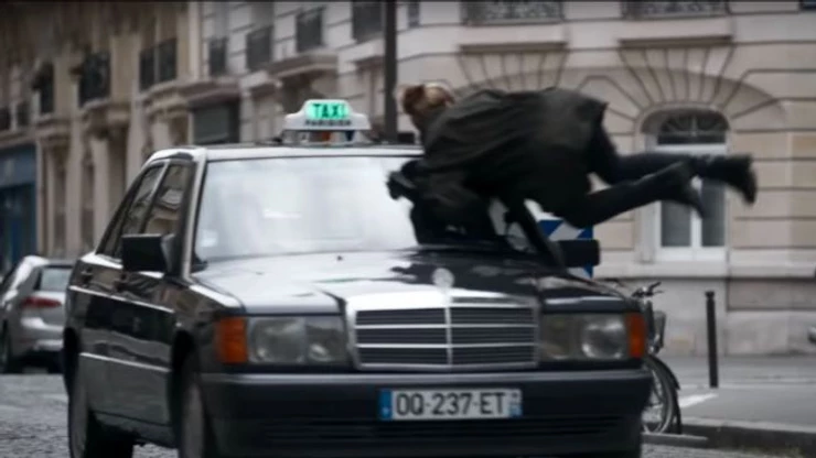 Villanelle hurls herself in front of a taxi on Rue Cesar Frank