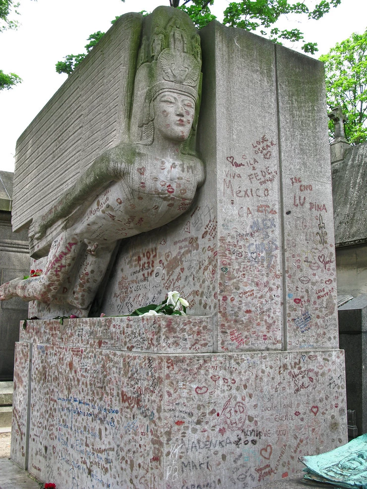 Oscar Wilde's tomb at Pere Lachaise Cemetery in Paris, covered with lipstick kisses from his superfans