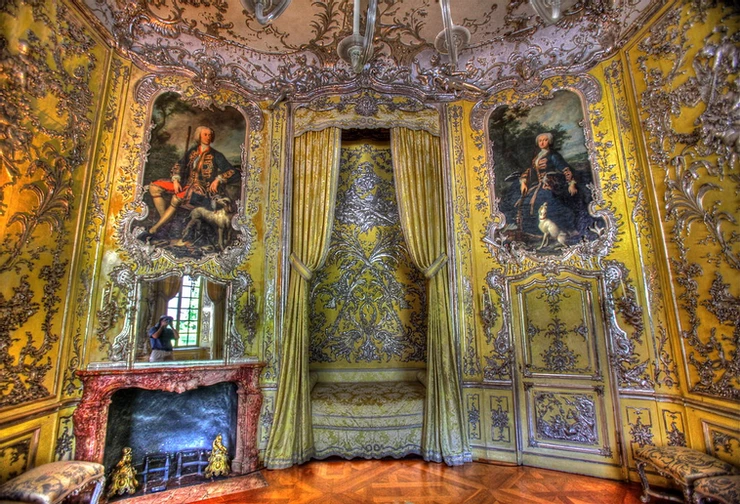 The lemon yellow and silver bedroom at Amalienburg -- look at the short little bed. The portraits flanking the bed are of Amalia and Karl.