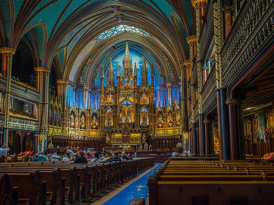 the blue-hued interior of Notre-Dame Basilica, an unmissable site in Montreal