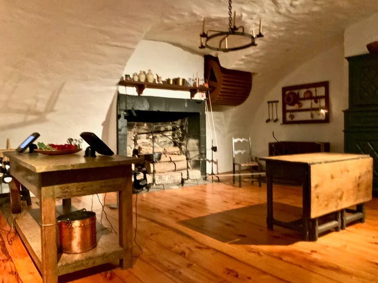 the fireplace and kitchen at Chateau Ramezay