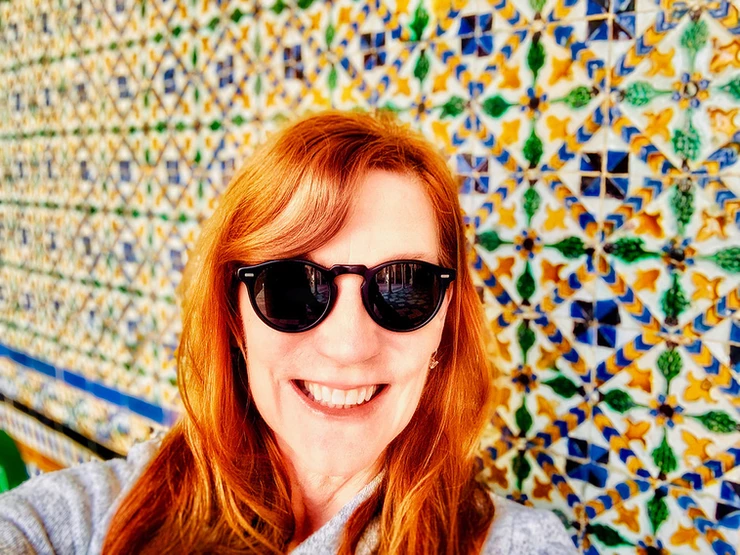 me, enjoying the beautiful tiles in the Casa de PIlatos in Seville