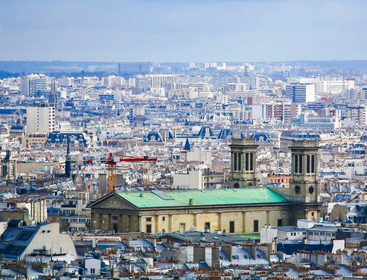 Paris cityscape as seen from Montmartre, with the Church of St Vincent de Paul, in the 10th arrondissement of Paris