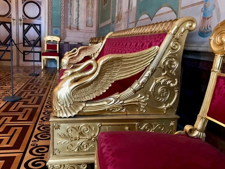 an adorable little swan motif on a couch in the Stone Rooms of the Munich Residenz