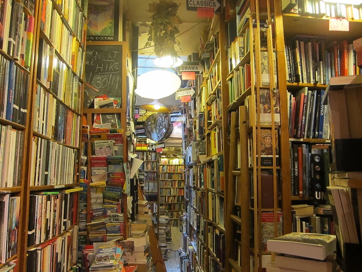 books piled floor to ceiling at Abbey Bookstore