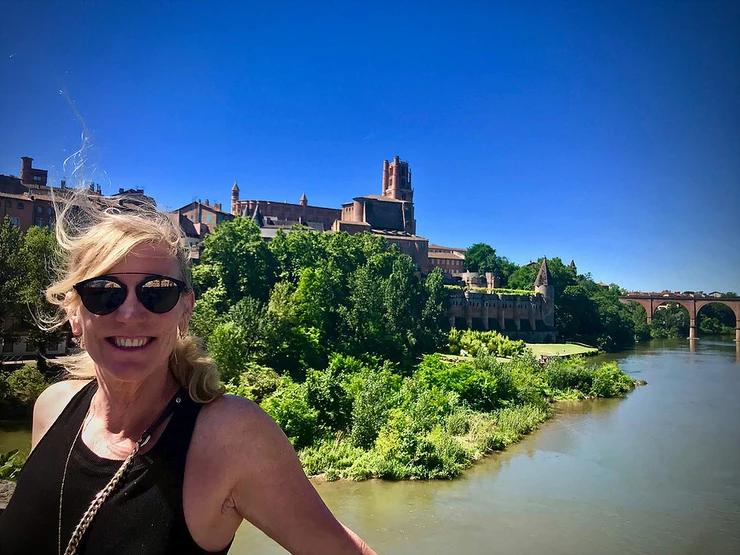 me on the Pont Vieux in Albi France, happy after getting my Toulouse-Lautrec fix