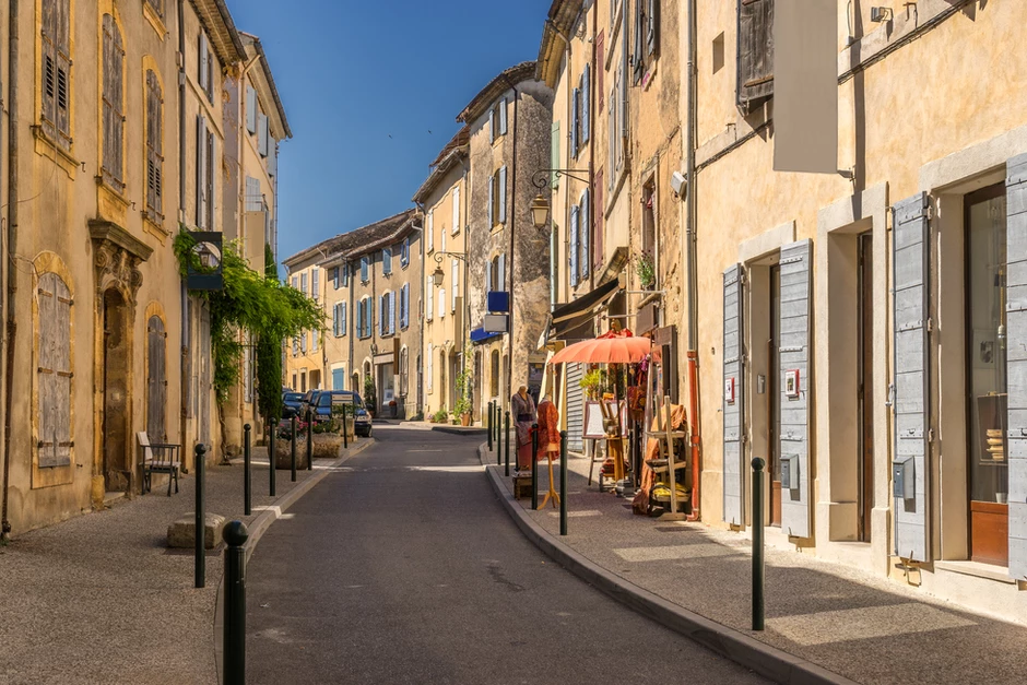 street in the hilltop village of Lourmarin  with French blue shutters