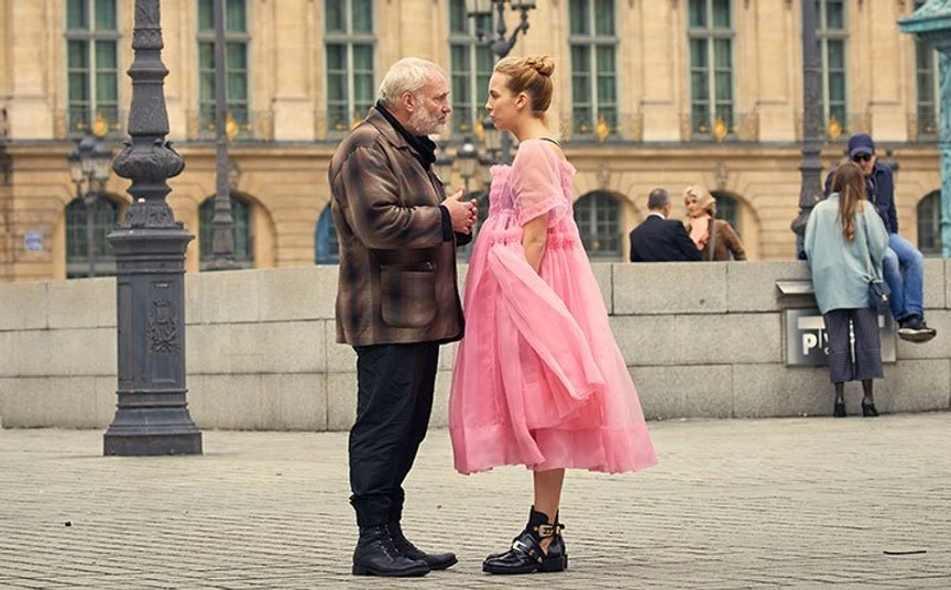 Villanelle in the Place Vendôme in Paris in a frothy pink Molly Goddard dress and Balenciga military boots.